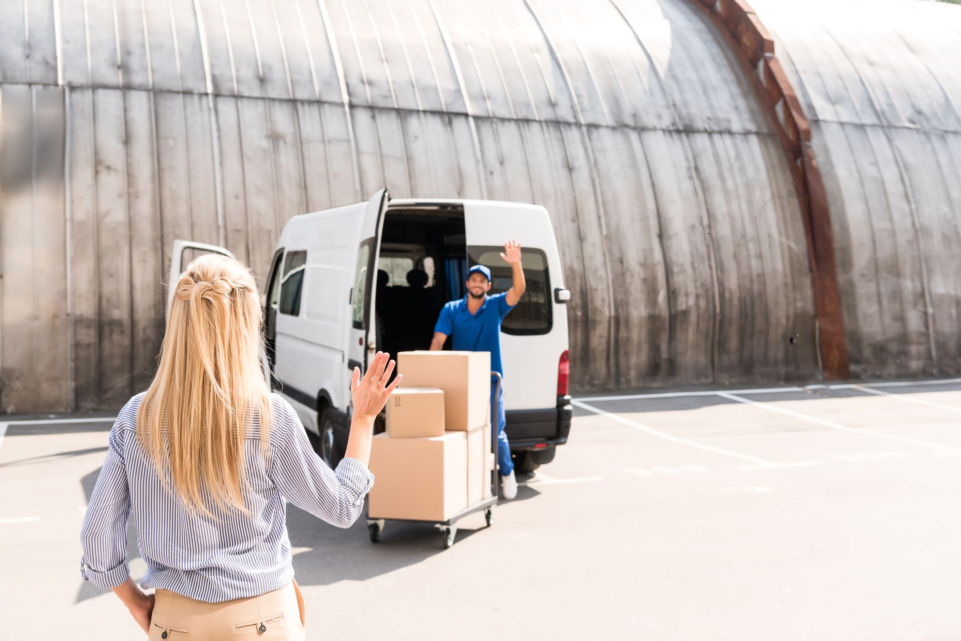 handsome-young-courier-delivering-packages-for-wom-2024-11-19-17-10-23-utc_lite